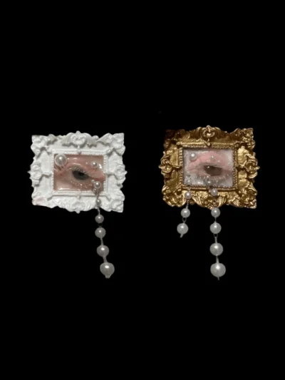 Pair of detailed handcrafted seashell eyeball sculptures with pearl dangles, in white and gold baroque frames. Whimsigoth decor and dark academia curiosity item.